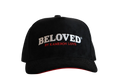 Beloved by Kameron Love black suede cap with red trim, front view
